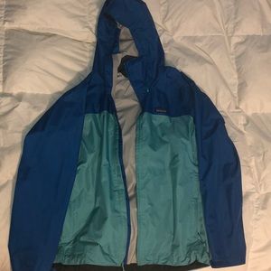 Blue Patagonia rain coat.